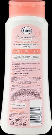Lotion corporelle légère pour une peau douce et nourrie, enrichie à la noix de coco et au beurre de karité. Flacon de 400 ml. »